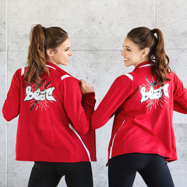 two sisters in red dance jackets