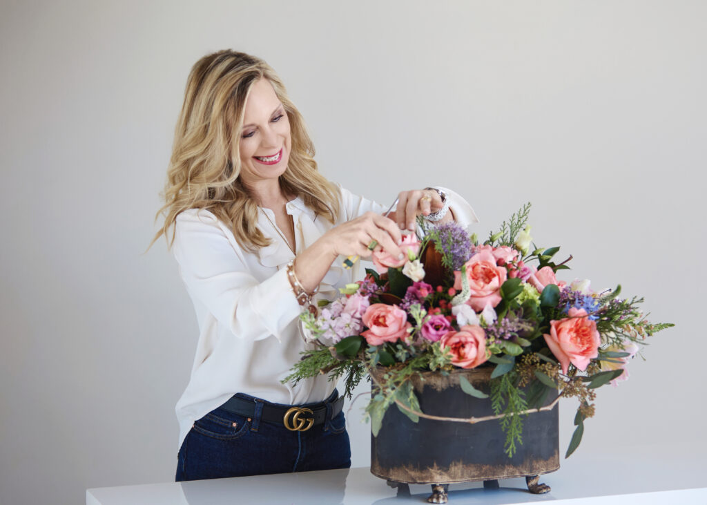 woman arranging flowers