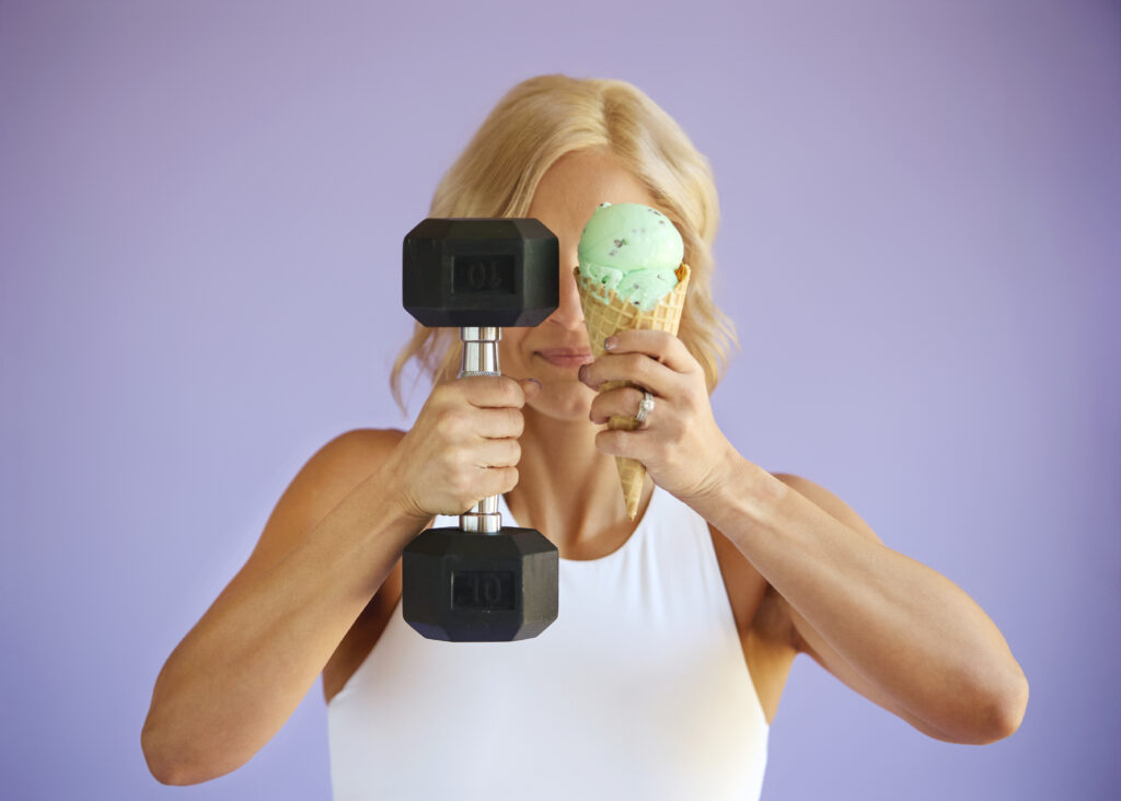 woman with a dumbbell and an icecream cone