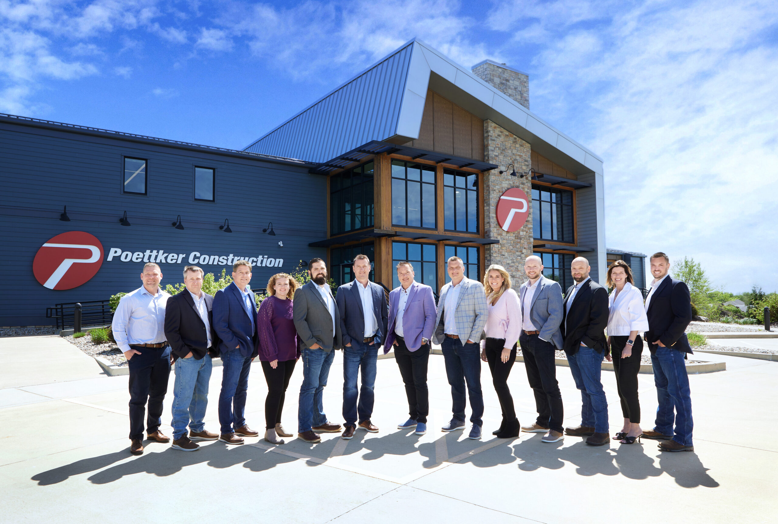 Poettker Construction Branding Team Photo in front of Poettker Headquarters, Breese IL